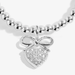 Close up of the Joma Jewellery A Little Prom bracelet showing silver plated beads and sparkly heart bow charm