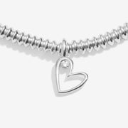 Close-up of Joma With Love bracelet open heart diamond charm