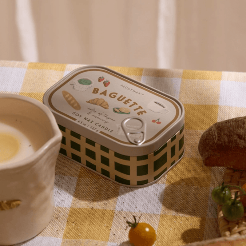 Paddywax Bistro French Baguette candle displayed on a café-style table
