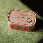 Paddywax Bistro Martini tin candle displayed on green background