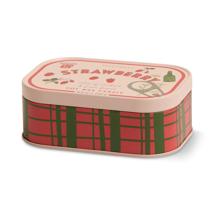 Side view of Paddywax Bistro Strawberry tin candle with red and green checked tin design