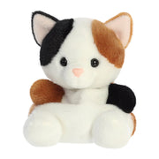 Angled front view of Palm Pals Calico Cat plush toy sitting pose