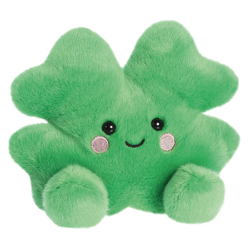 Close front view of Palm Pals Chance Clover plush toy showing embroidered cheeks and smile