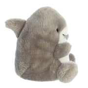 Side view of Palm Pals Chomps Shark plush toy showing fins and rounded shape.

