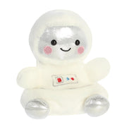 Angled front view of Palm Pals Cosmo Astronaut plushie with smiling face and silver boots