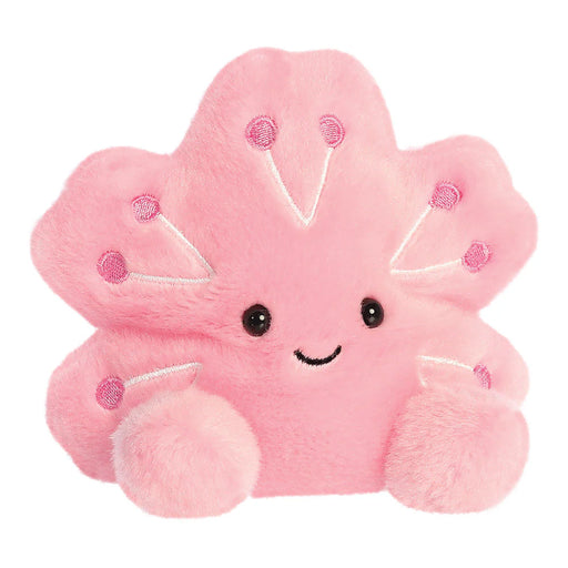 Angled front view of Palm Pals Hana Cherry Blossom plushie with stitched smile