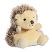 Angled view of Palm Pals Hedgie Hedgehog plush toy, cute smile and bean-filled body.