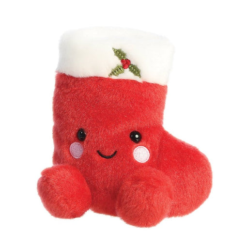 Front angled view of Holly Stocking plush with smiling face and pom-pom paws