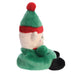 Side profile of Jolly Elf plush with pointed ear and pom-pom paw