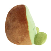 Side view of Palm Pals Kimber Kiwi plush toy showing fuzzy rind