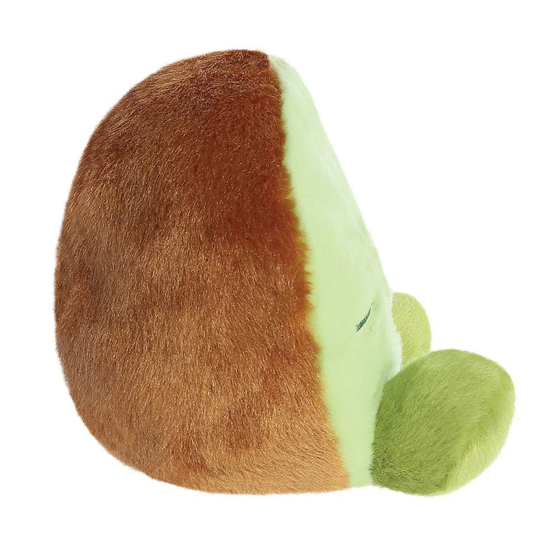 Side view of Palm Pals Kimber Kiwi plush toy showing fuzzy rind