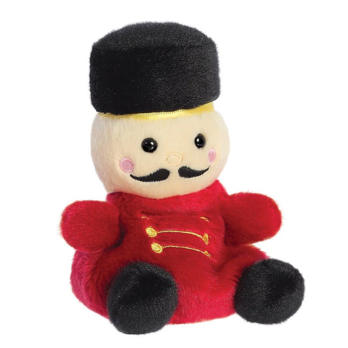 Angled view of Palm Pals Marius Nutcracker plush with gold embroidered buttons