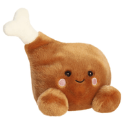 Angled view of Palm Pals Mila Drumstick plush toy with white bone