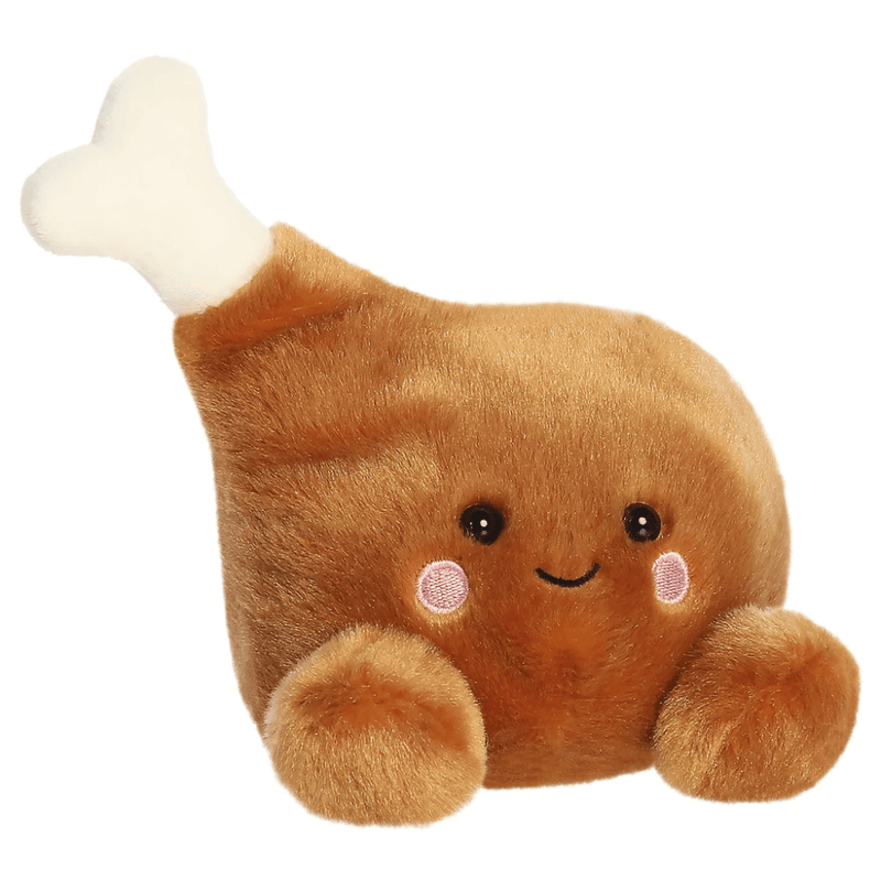 Angled view of Palm Pals Mila Drumstick plush toy with white bone