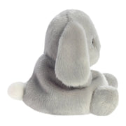 Side view of Palm Pals Pebbles Bunny plush toy sitting pose