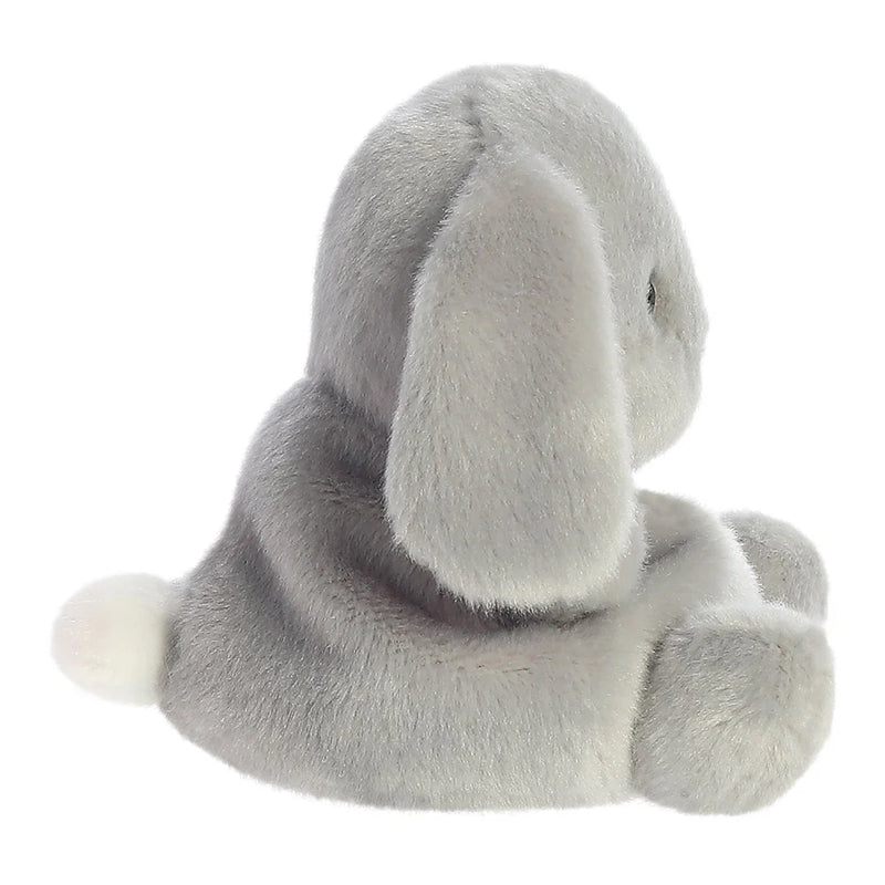 Side view of Palm Pals Pebbles Bunny plush toy sitting pose
