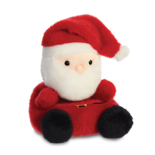 Angled view of Palm Pals Santa plush, smiling face and seated pose