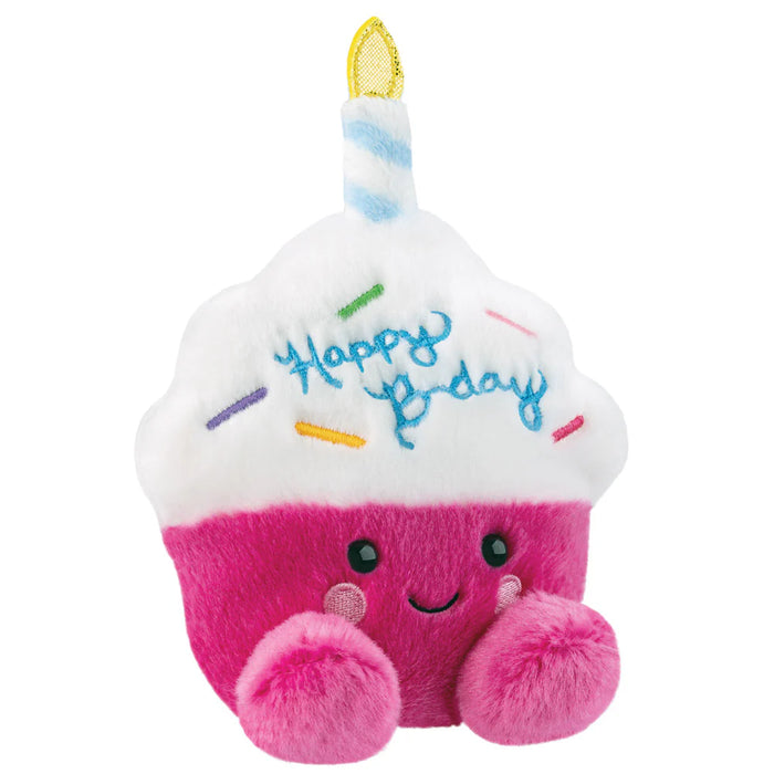 Angled front view of Palm Pals Sparkle Birthday Cupcake plush toy with smiling face