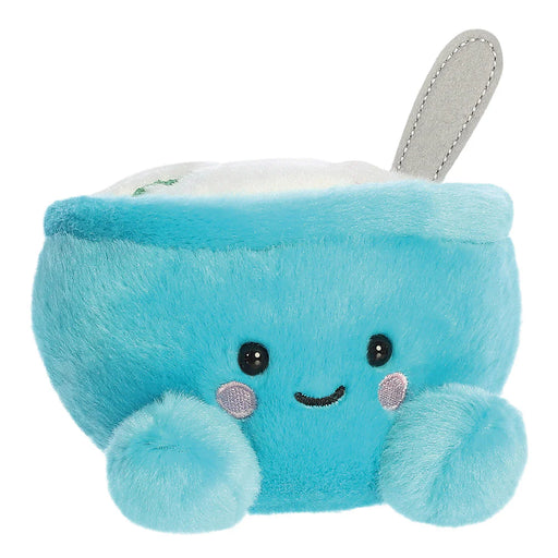 Angled front view of Palm Pals Trixie Cereal plush toy with spoon detail