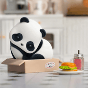 Cat’s Nest design: panda curled in a cardboard box with a burger prop – Panda Roll Blind Box figure
