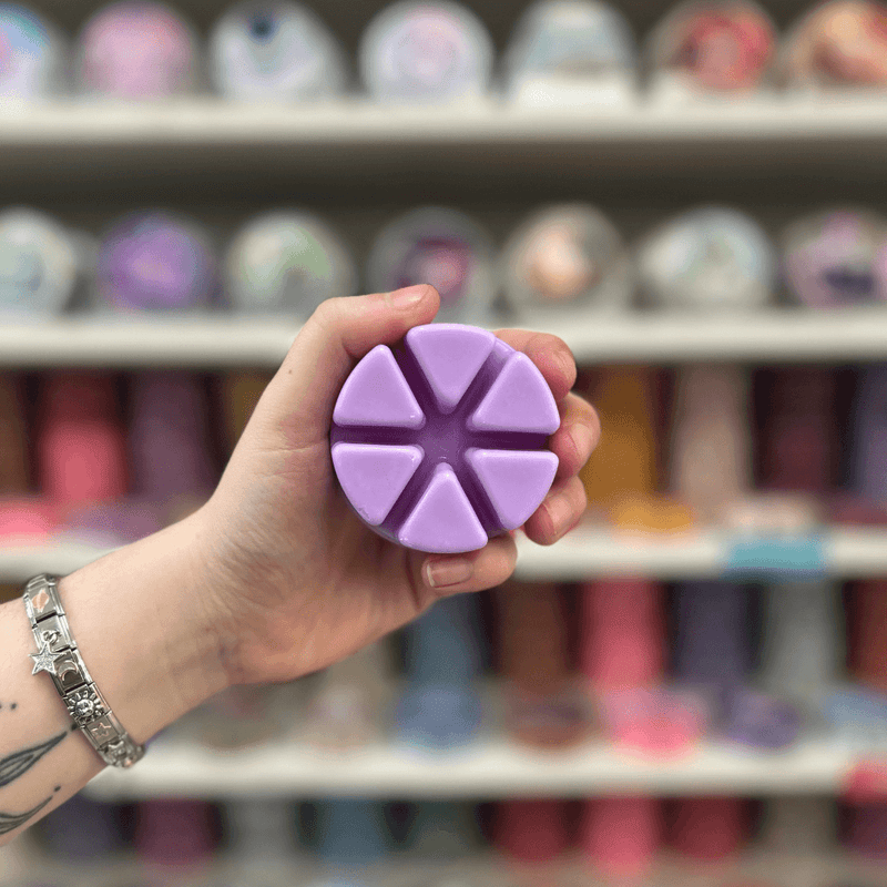 Parma Violet lilac segmented wax melt held in hand