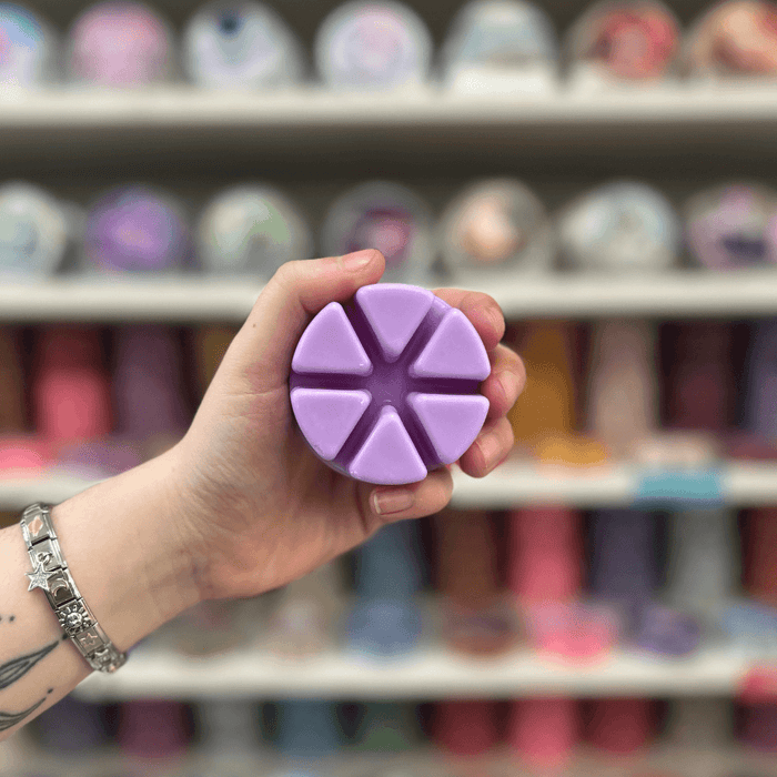 Parma Violet lilac segmented wax melt held in hand