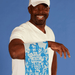 Person holding Party’s In The Kitchen dish towel, blue woven design, lifestyle photo.