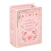 Pink ceramic book vase with Buy Yourself the Flowers cover design