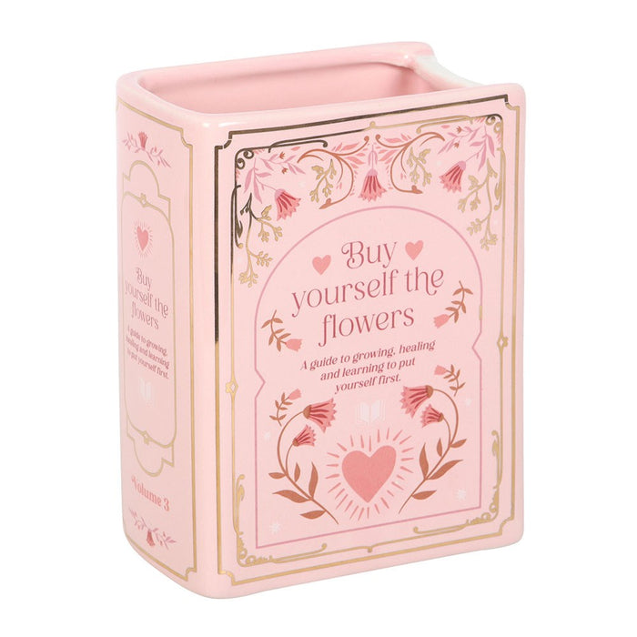 Pink ceramic book vase with Buy Yourself the Flowers cover design