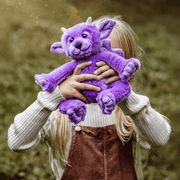 Portcullis Charlie Bears Bearhouse purple gargoyle plush toy being cuddled, soft collectible character teddy