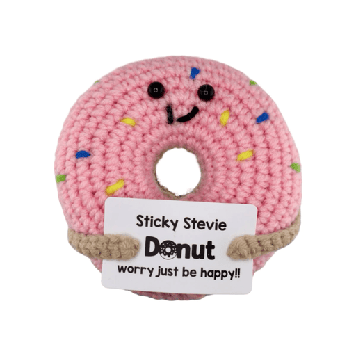 Pink crochet donut decoration with sprinkles holding donut worry just be happy message card