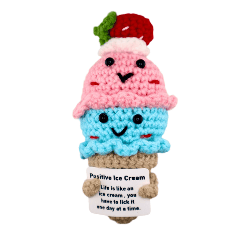 Crochet pink and blue ice cream cone decoration holding positive message card