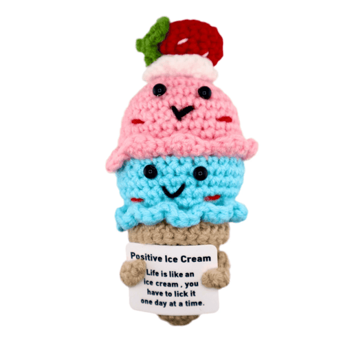 Crochet pink and blue ice cream cone decoration holding positive message card