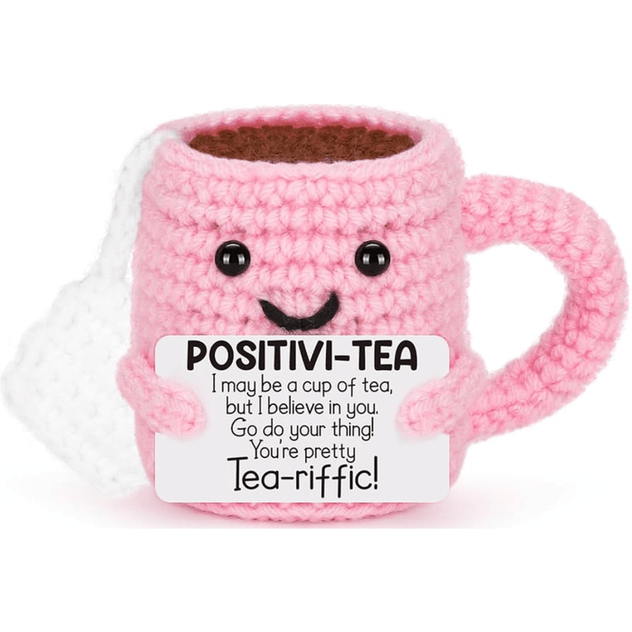 Pink crochet tea mug decoration holding a positivi-tea encouragement message card