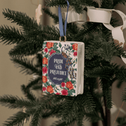 Pride and Prejudice book shaped ceramic Christmas ornament hanging on a tree