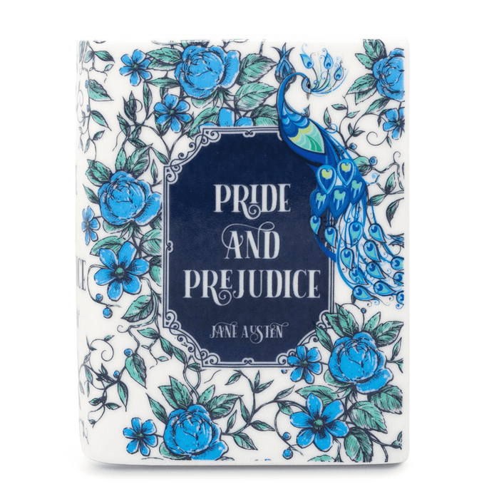 Pride and Prejudice book candle angled view showing the peacock artwork and blue floral cover.