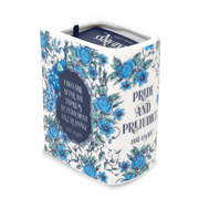 Angled view of Pride and Prejudice book candle showing the quote panel and blue floral pattern.