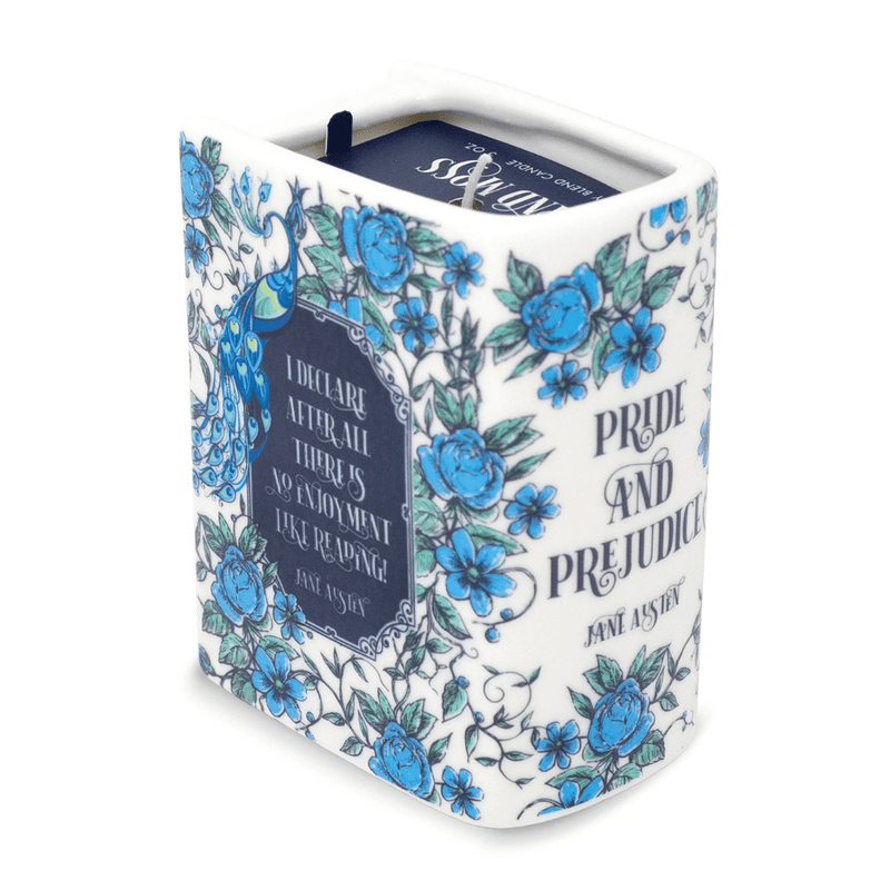 Angled view of Pride and Prejudice book candle showing the quote panel and blue floral pattern.