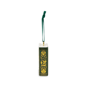 Decorative spine of Pride and Prejudice ceramic book ornament with gold floral patterns, Jane Austen lettering and green hanging ribbon