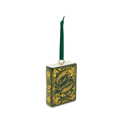 Angled view of Pride and Prejudice ceramic book decoration with ornate gold flowers, peacock feathers and green ribbon