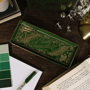 Pride and Prejudice literary trinket tray on a desk with stationery and book
