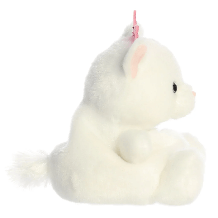 Side view of Priscilla Princess Kitty Palm Pals plush showing soft white fur, small tail and pink crown detail.