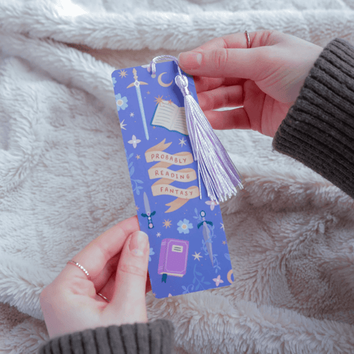 Probably Reading Fantasy bookmark held in hands showing fantasy book and sword design