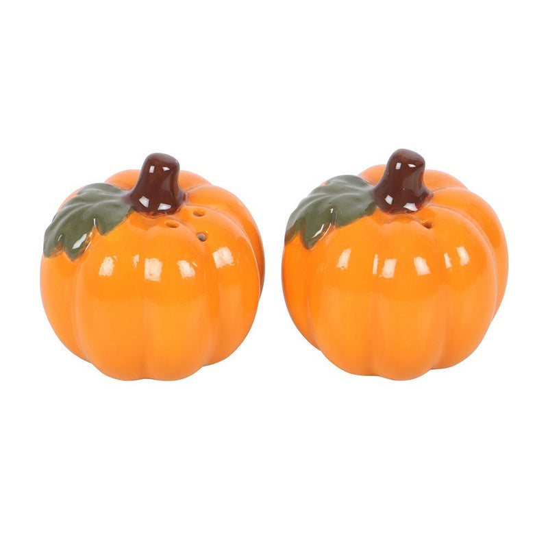 Front view of two orange pumpkin-shaped salt and pepper shakers on a white background.
