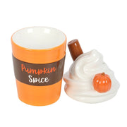 Oil burner with white swirl lid removed, revealing melt bowl and separate cup base.
