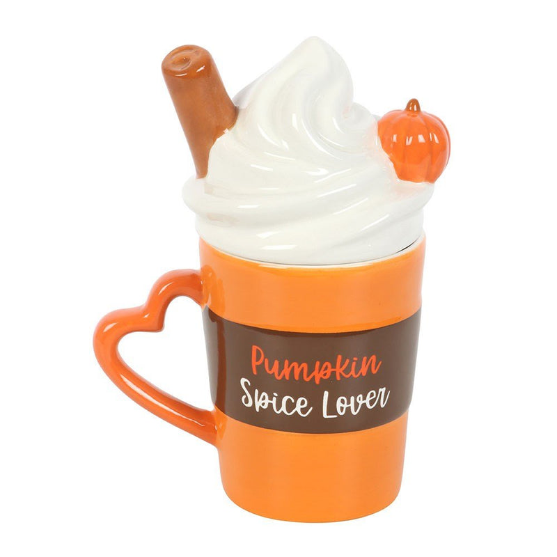 Front view of orange Pumpkin Spice Lover ceramic mug with white swirl lid and heart handle.
