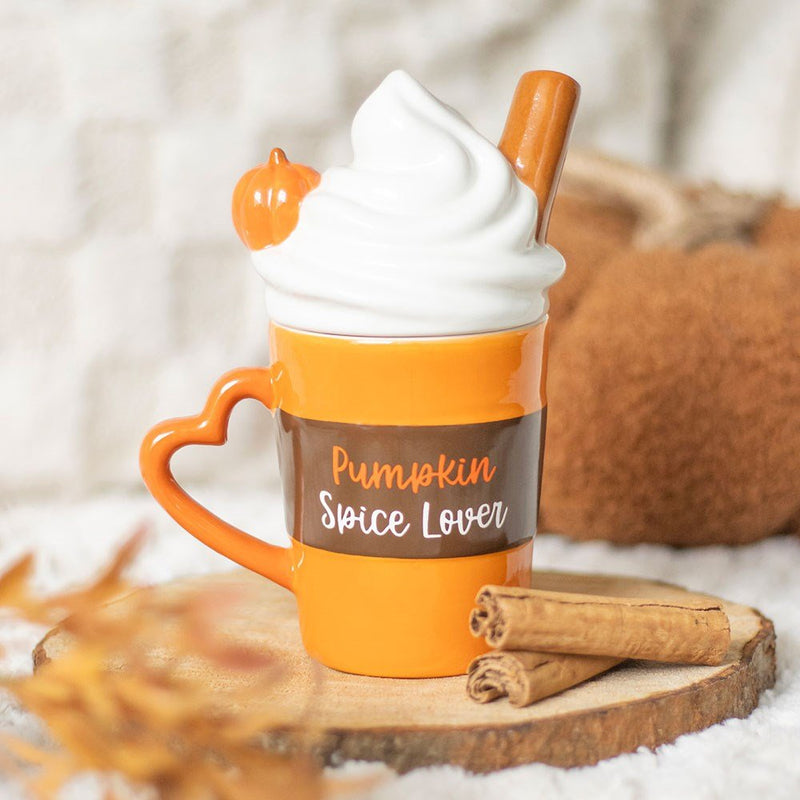 Pumpkin Spice Lover mug with whipped-cream lid, cinnamon stick and pumpkin detail styled on rustic wood slice.
