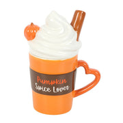 Top-back view displaying swirl lid, heart handle and glossy orange glaze.

