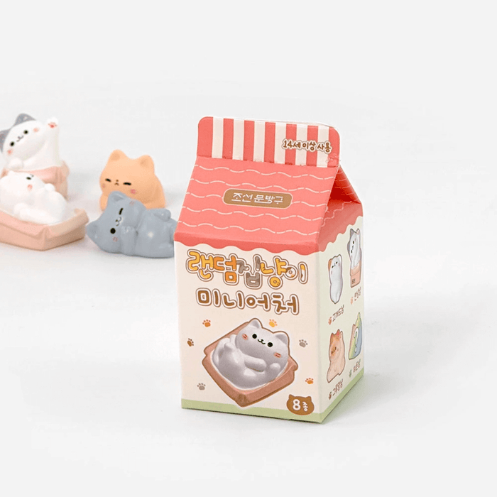 Random Cozy Cat miniature blind box packshot with cat figures blurred in the background