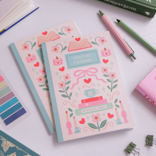 Reading Journal notebooks styled with pens and stationery